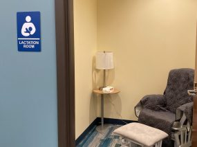 Lactation room with a chair, footstool, and lamp