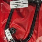 Red pouch with a bike lock and library markings
