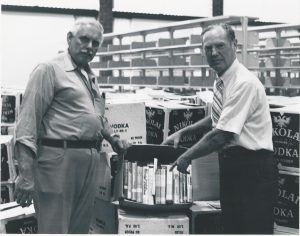 Richard Samuelson and George Roland unpacking boxes of books
