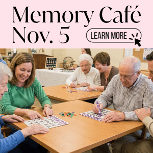 Adults helping elderly adults to play  Bingo